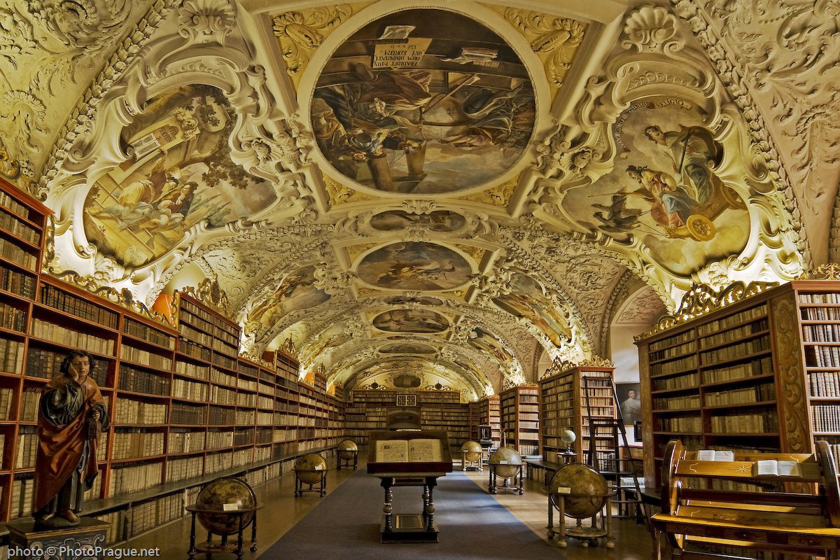 A Baroque library with a vaulted ceiling adorned with detailed frescoes and wooden shelves filled with antique books